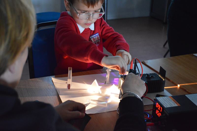 Young boy with glasses doing an activity